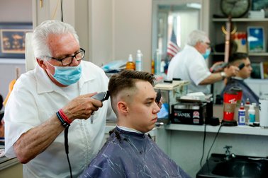 Barber with mask under his nose